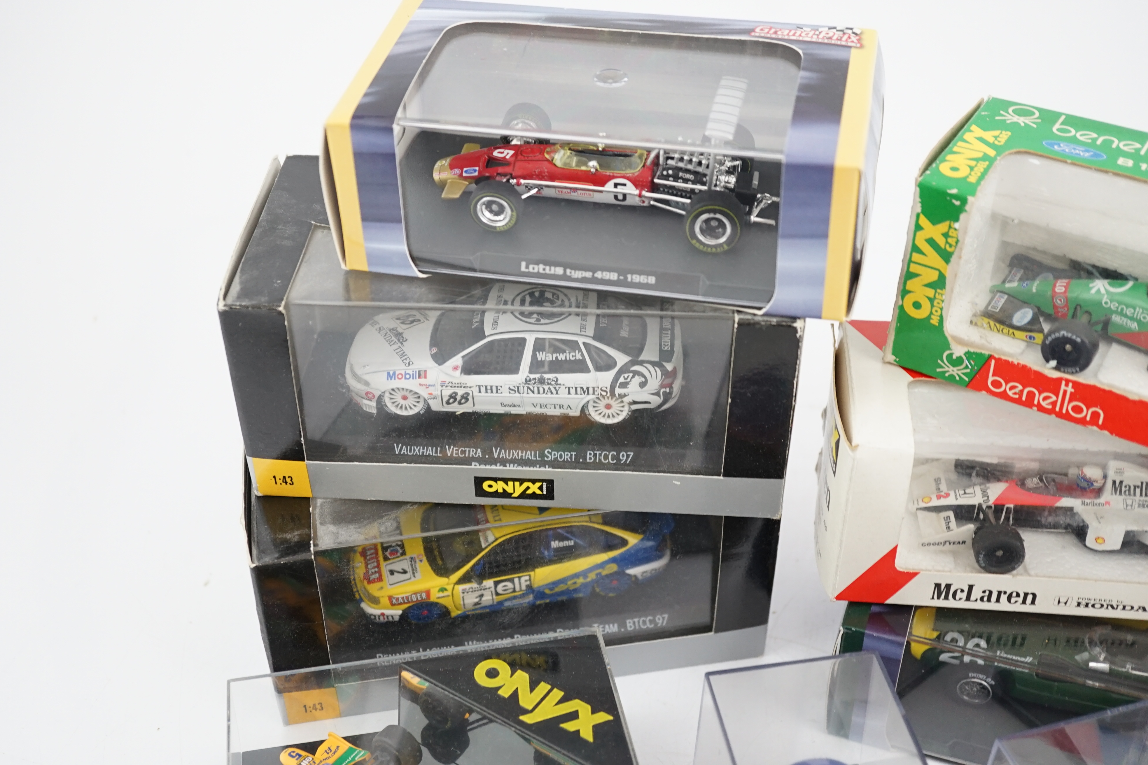 Thirty-seven boxed diecast motor racing related models by Onyx, Atlas Editions, etc. including 1:43 scale Formula One racing cars, models of helmets of famous drivers, etc.